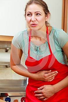 Woman suffering from stomach ache abdominal pain