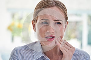 Woman Suffering With Toothache Touching Jaw