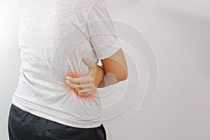 Woman suffering from waist, backache or hip pain on white background. Office syndrome and health concept.