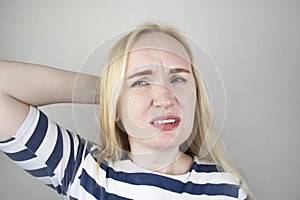 A woman suffers from headache or hypertension. The concept of treatment and prevention of migraine