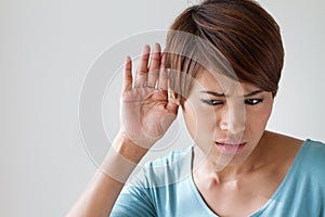 Woman suffers from hearing impairment, hard of hearing photo