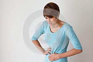 Woman suffers from menstruation pain or stomach ache