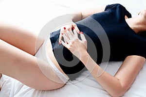 Woman suffers from menstruation pain or stomach ache