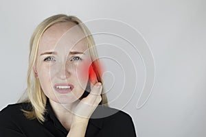 A woman suffers from pain in the ear. The auditory meatus hurts due to otitis media, cerumen plug, ear boil, or trigeminal