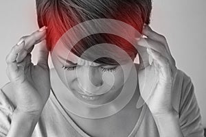 Woman suffers from pain, headache, sickness, migraine, stress photo