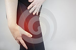 A woman suffers from pain in the outer thigh. The concept of treating a hip joint for trauma, plantation or osteoarthritis