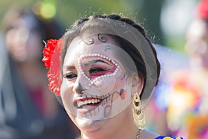 Woman with sugar skull makeup during Day of the Dead