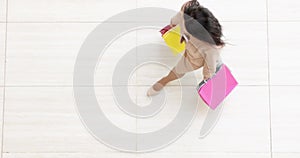 Woman in suit carrying multicolored shopping bags top view 4k movie