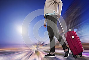 Woman with suitcase awaiting aircraft