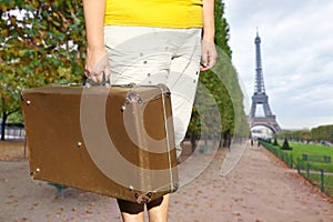 Woman with suitcase. Paris and the tower