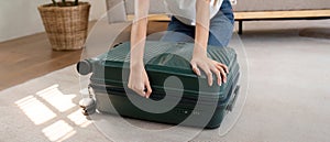 Woman and suitcase for travel summertime vacation packing clothing. relax and getaway preparation