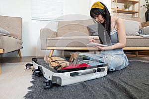 Woman and suitcase for travel summertime vacation packing clothing. relax and getaway preparation