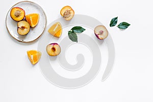 Woman summer breackfast with orange and peach fruits on plates on white background flat lay mockup