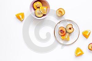 Woman summer breackfast with orange and peach fruits on white background flat lay mockup