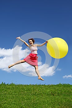 Woman in summer pushes off from earth