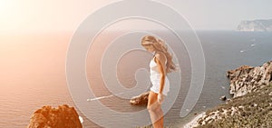 Woman summer travel sea. Happy tourist enjoy taking picture outdoors for memories. Woman traveler posing over sea bay