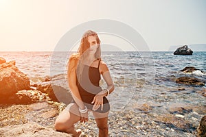 Woman summer travel sea. Happy tourist in hat enjoy taking picture outdoors for memories. Woman traveler posing on the