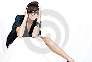 Woman with sun glasses on white background