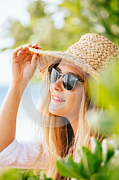 Woman in sun hat on the beach