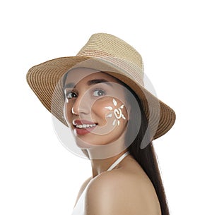 Woman with sun protection cream on her face against white background