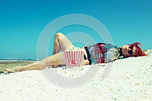 Woman in the sun on the sand of Popcorn Beach in Fuerteventura