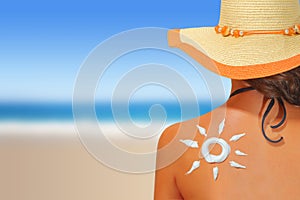 Woman with sun shaped sunscreen