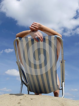 Woman sunbathing on the beach