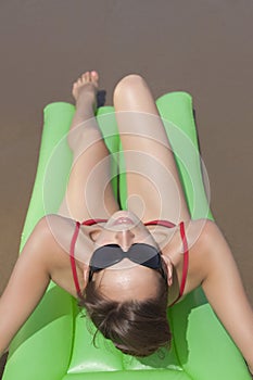 Woman sunbathing on the beach