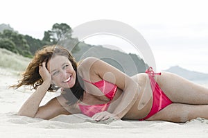 Woman sunbathing on beach