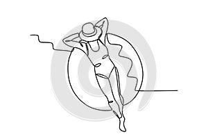 A woman is sunbathing on a flotation device