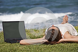 Woman sunbathing on grass