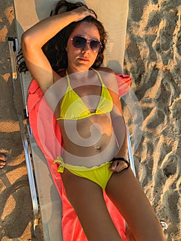Woman on sunbed angled view