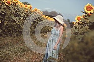 Woman in sunflowers field