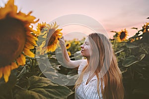 Woman in sunflowers field harmony with nature