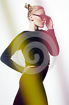 Woman, sunglasses for beauty and light streak, cosmetics or makeup with creativity and neon glow on white background