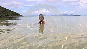 Woman in sunglasses lies on sandy beach summer vacation concept.