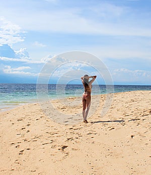 Woman on sunny beach. Tropical beach photo. Beautiful girl on beach.