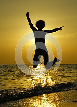 Woman at sunrise jump