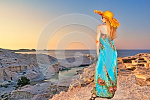 Woman at sunset on Sarakiniko in Milos, Greece