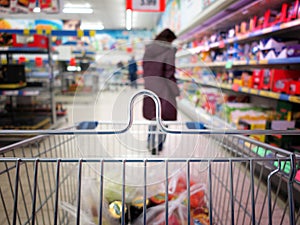 Woman at the supermarket with trolley