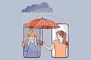 Woman supports upset friend by holding umbrella over girl head, leaning out of phone screen