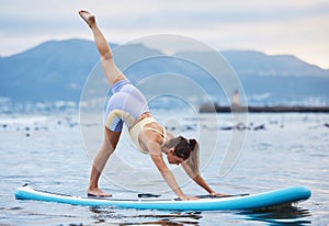 Woman, surfboard or water yoga on ocean or sea in relax workout, training or exercise for core balance, health or