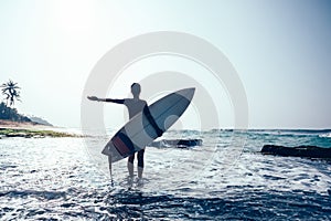 Woman surfer with surfboard