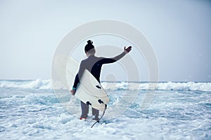 Woman surfer with surfboard