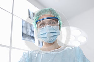 Woman surgeon in sterile suit in operating room