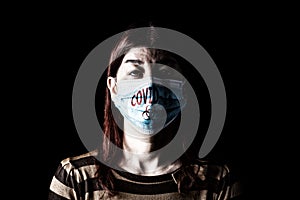 Woman with surgical mask. Biohazard and COVID-19, aka Coronavirus symbol. Pandemic or epidemic and scary, fear or danger concept.