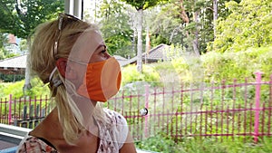 Woman with surgical mask in Switzerland train