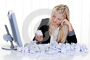 Woman Surrounded by Crumpled Paper