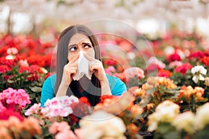Woman Surrounded by Flowers Suffering from Allergies