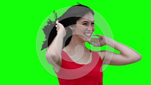 Woman swaying while flicking her hair